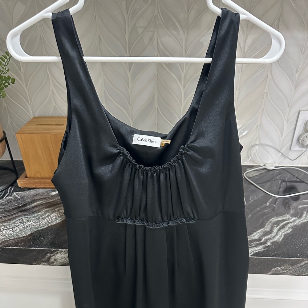 Calvin Klein midi black babydoll dress size 6 but runs large.